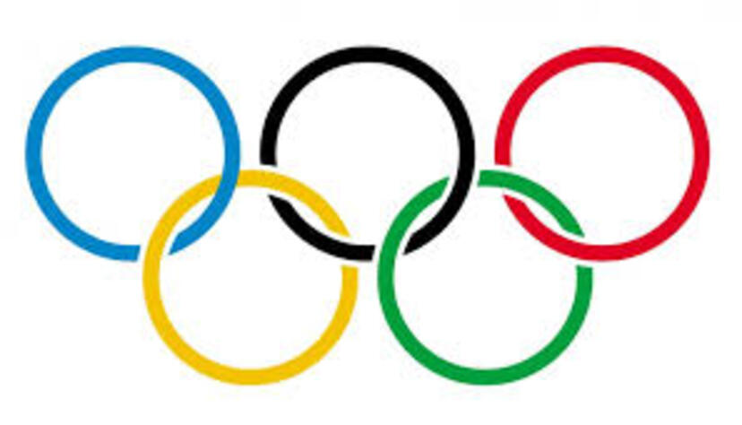 Pięć kolorowych, przecinających się kółek - symbol Olimpiady.
